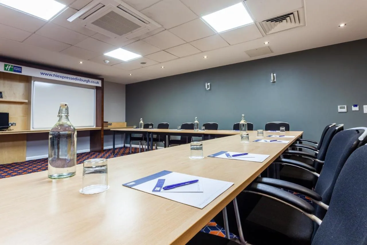 Conference room with long table and chairs at Holiday Inn Express Edinburgh – Royal Mile